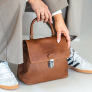 Styled Fit Perspective of Angera Full-Grain Leather Handbag 여성용 on Model - Natural Daylight Drape