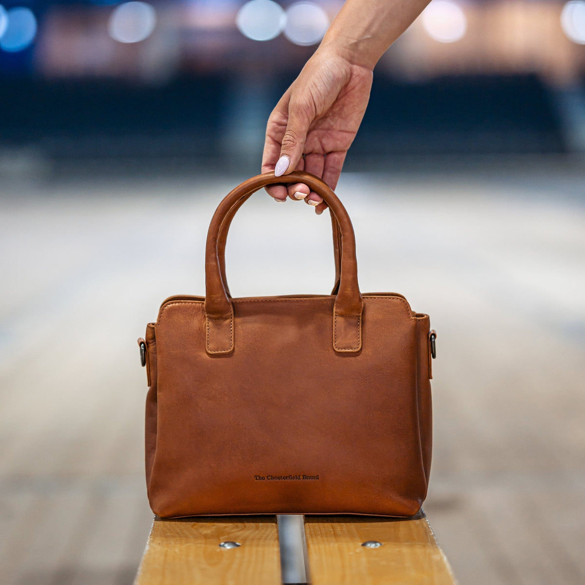 Styled Fit Perspective of Hermosa Full-Grain Leather Handbag 여성용 on Model - Natural Daylight Drape