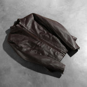 
오픈 헴 밑단과 장인 정신이 깃든 마감 디테일 Rumella Maroon Leather Biker Jacket