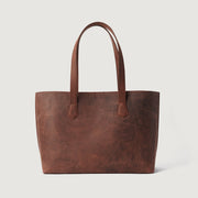 
The Bianca Vintage Distressed Brown Leather Tote Bag For Women - 수납 깊이와 확장 용량을 보여주는 측면 뷰